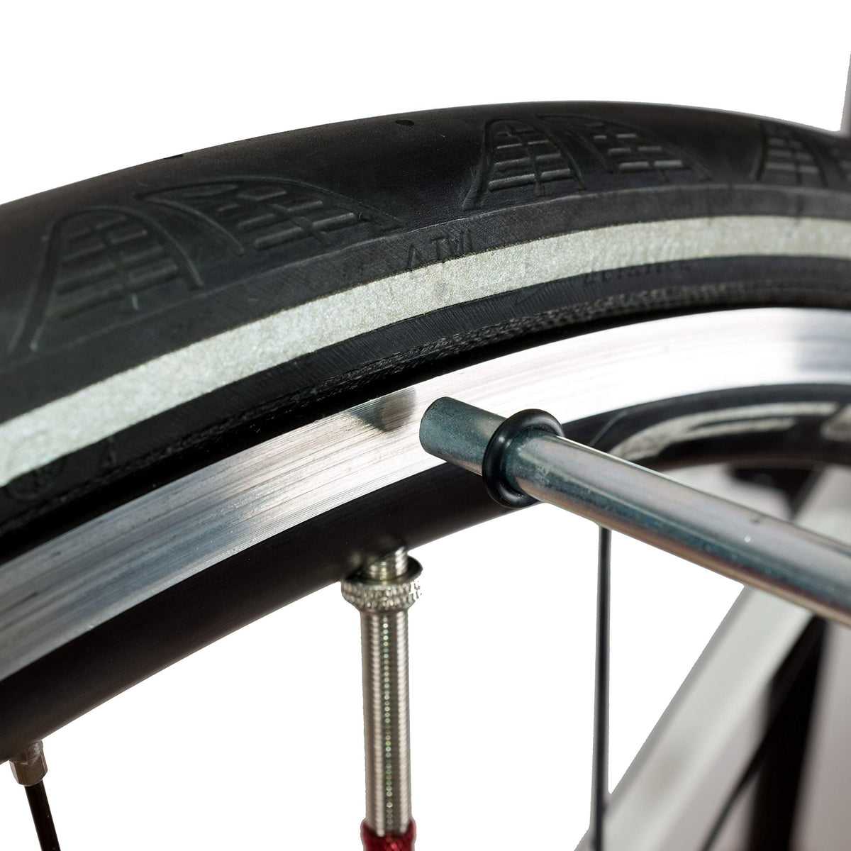 Close-up of the indicator tip touching the rim