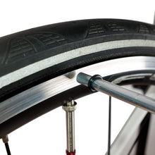 Close-up of the indicator tip touching the rim