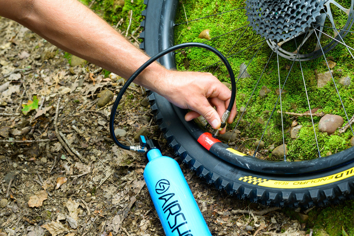 Screwing the Airshot's hose onto a tubeless tire valve