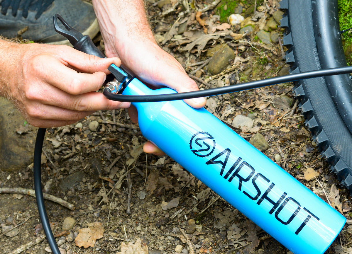 Hand opening the Airshot's release tap
