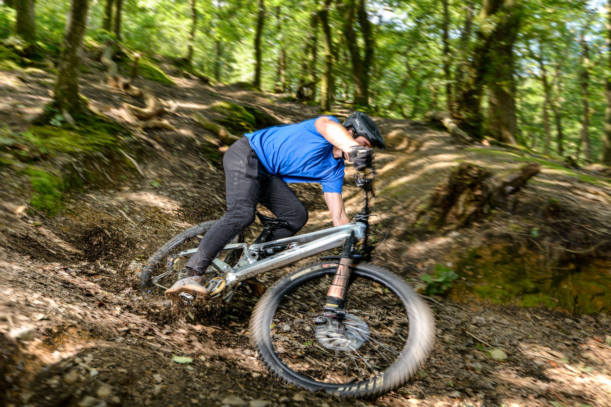 Mountain biker leaning into a dirt corner